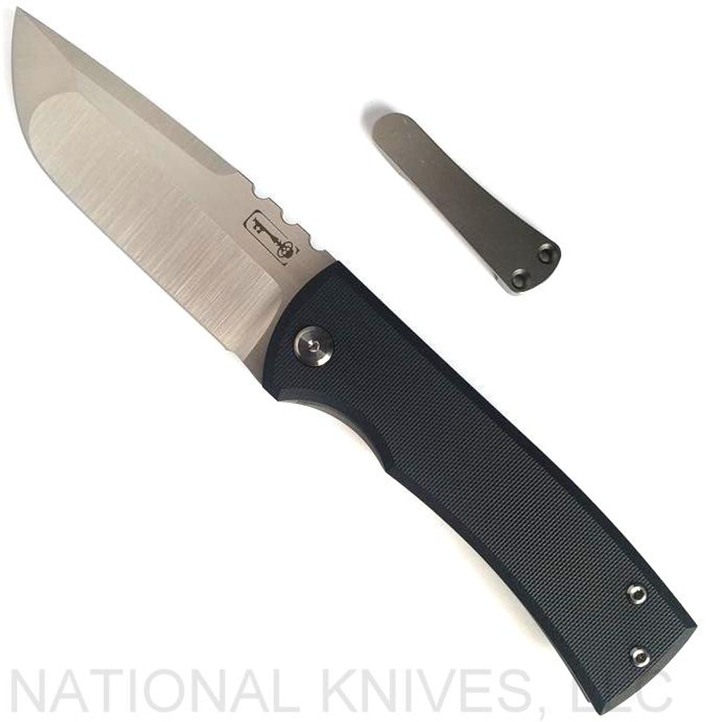 Chaves Knives Redencion 229 Drop Point folding knife with flipper tab - shown open presentation side with extra pocket clip aside it.  M390 stainless steel plain edge blade.  Black G-10 handle.  Model 229/KS/RDP/G10BK.
