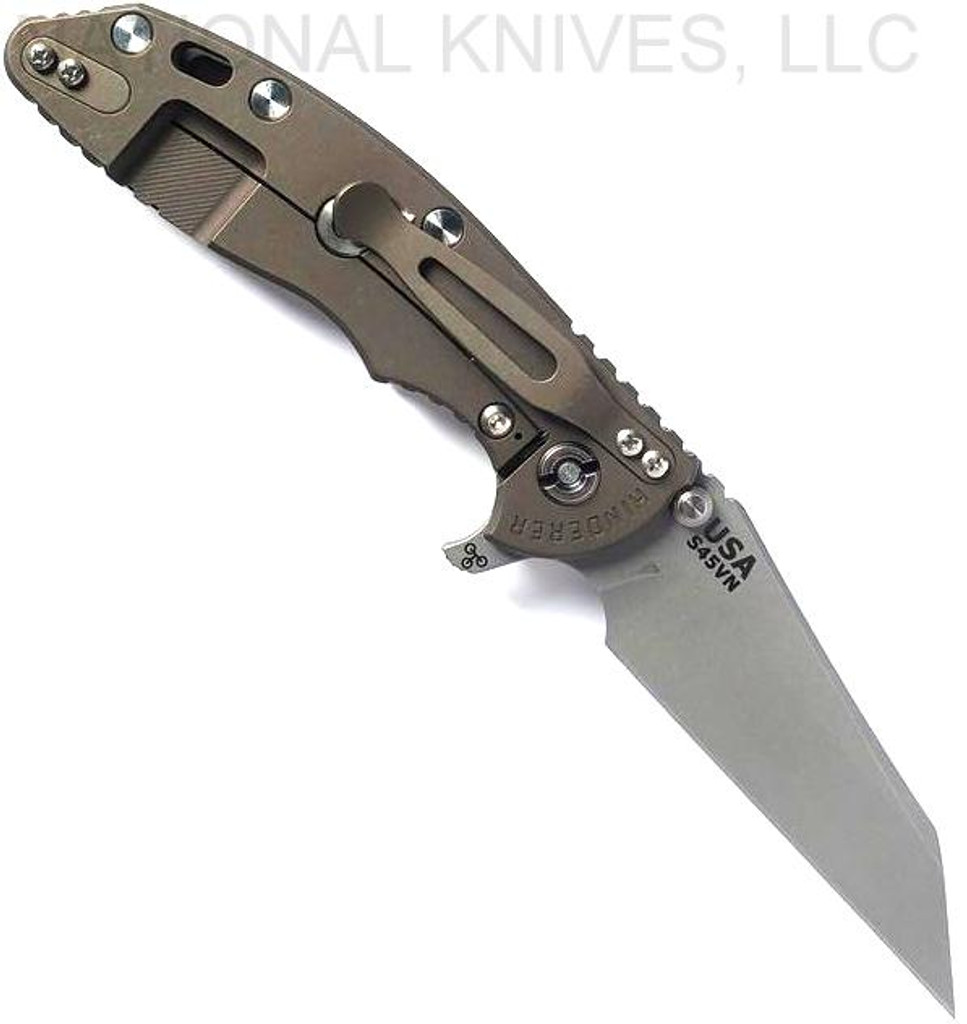 Rick Hinderer Knives Fatty XM-18 3.5" Wharncliffe folding knife with thumb stud and flipper tab - shown open lock side.  Working Finish S45VN stainless steel plain edge blade.  Coyote G-10 handle with Battle Bronze lock side.  Model KXM35FAWC.