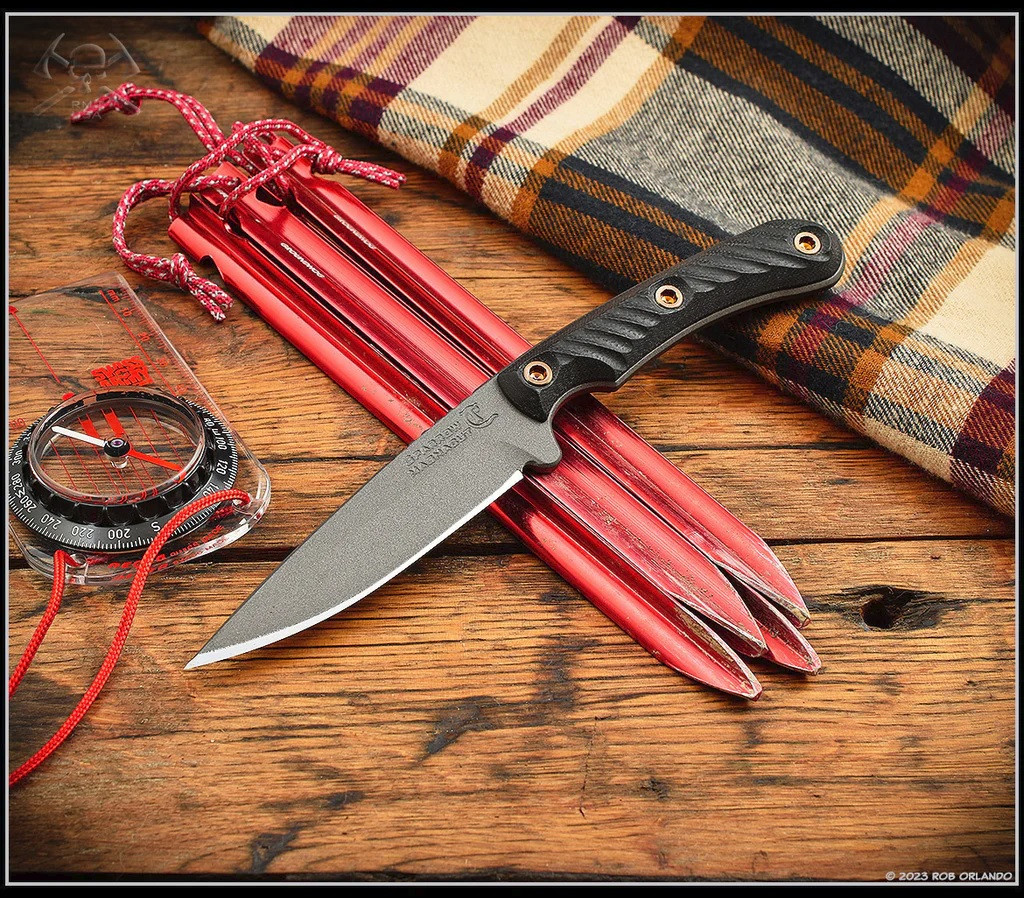 RMJ Tactical Sparrow fixed blade knife - shown out of sheath obverse.  Tungsten Cerakote MagnaCut stainless steel plain edge blade.  Black G-10 handle.  Model K-SP-MC-TU-BK.
