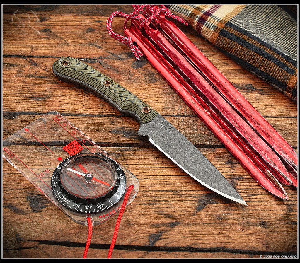 RMJ Tactical Sparrow fixed blade knife - shown out of sheath reverse.  Tungsten Cerakote MagnaCut stainless steel plain edge blade.  Dirty Olive G-10 handle.  Model K-SP-MC-TU-DO.

