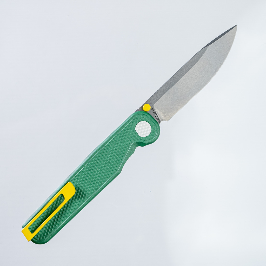 Tactile Knife Co Seasonal Release Fairway Rockwall folding knife with a thumb stud - shown open pocket clip side.  Stonewashed MagnaCut stainless steel plain edge blade.  Green coated titanium handle.  Model 20-RT-MCFW-TTFW.