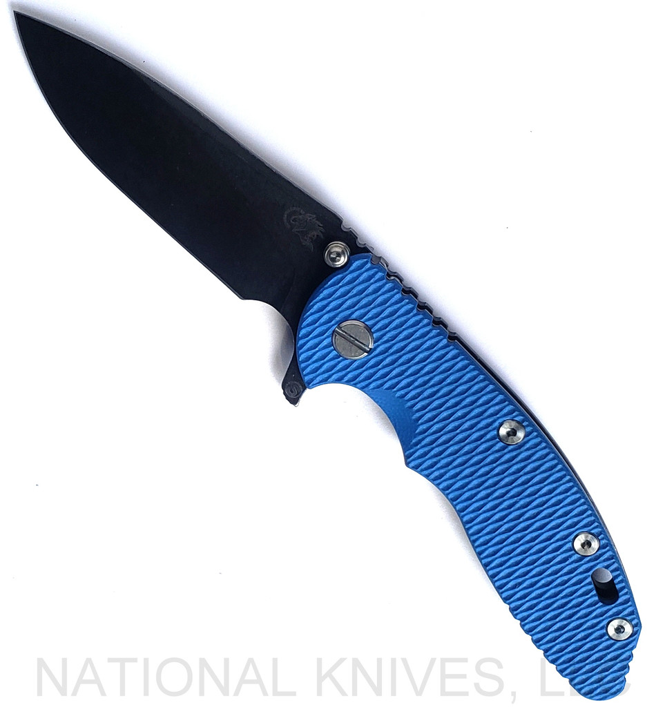 Rick Hinderer Knives Skinny XM-18 3.5" Slicer folding knife with thumb stud and flipper tab - shown open presentation side.  Battle Black MagnaCut stainless steel plain edge blade.  Blue G-10 handle with Battle Black lock side.  Model KXM35SKSLDLC.