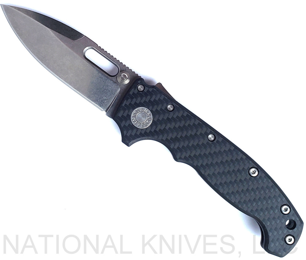 Demko Knives National Knives, LLC Exclusive MG AD-20 spear point folding knife with thumb slot and thumb stud - shown open presentation side.  Stonewash MagnaCut stainless steel plain edge blade.  Black carbon fiber handle.