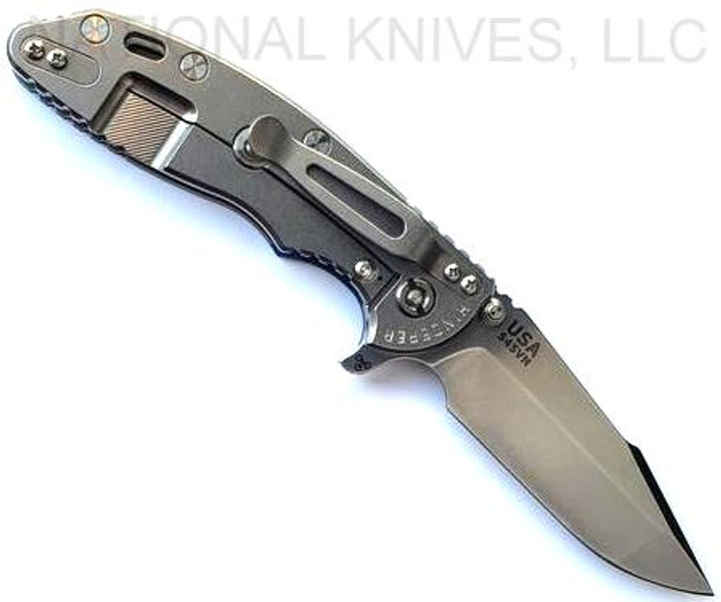Rick Hinderer Knives XM-18 3.5" Harpoon Spanto folding knife with thumb stud and flipper tab - shown open lock side.  Stonewash S45VN stainless steel plain edge blade.  Blue - black G-10 handle with stonewash lock side.  Model KXM35HS.