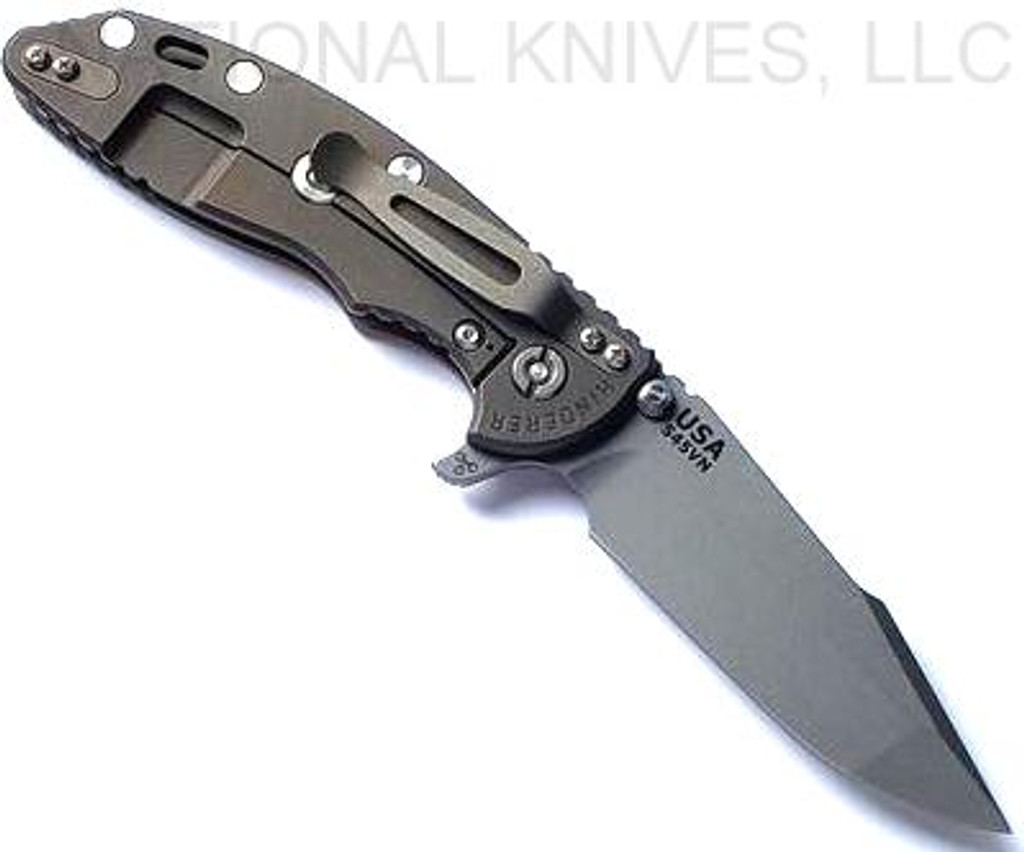 Rick Hinderer Knives XM-18 3.5" Harpoon Spanto folding knife with thumb stud and flipper tab - shown open lock side.  Working Finish S45VN stainless steel plain edge blade.  
FDE G-10 handle with Battle Bronze lock side.  Model KXM35HS.