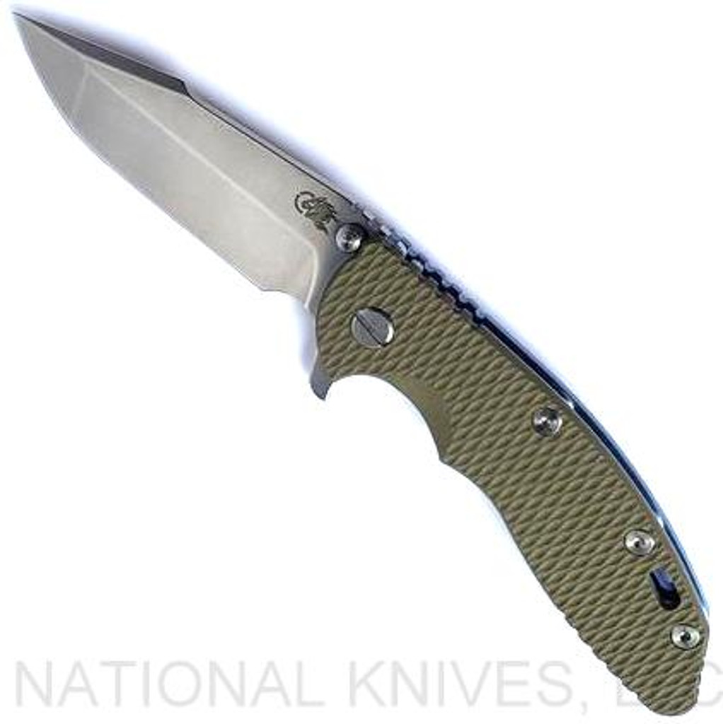 Rick Hinderer Knives XM-18 3.5" Harpoon Spanto folding knife with thumb stud and flipper tab - shown open presentation side.  Stonewash S45VN stainless steel plain edge blade.  
OD green G-10 handle with stonewash blue lock side.  Model KXM35HS.