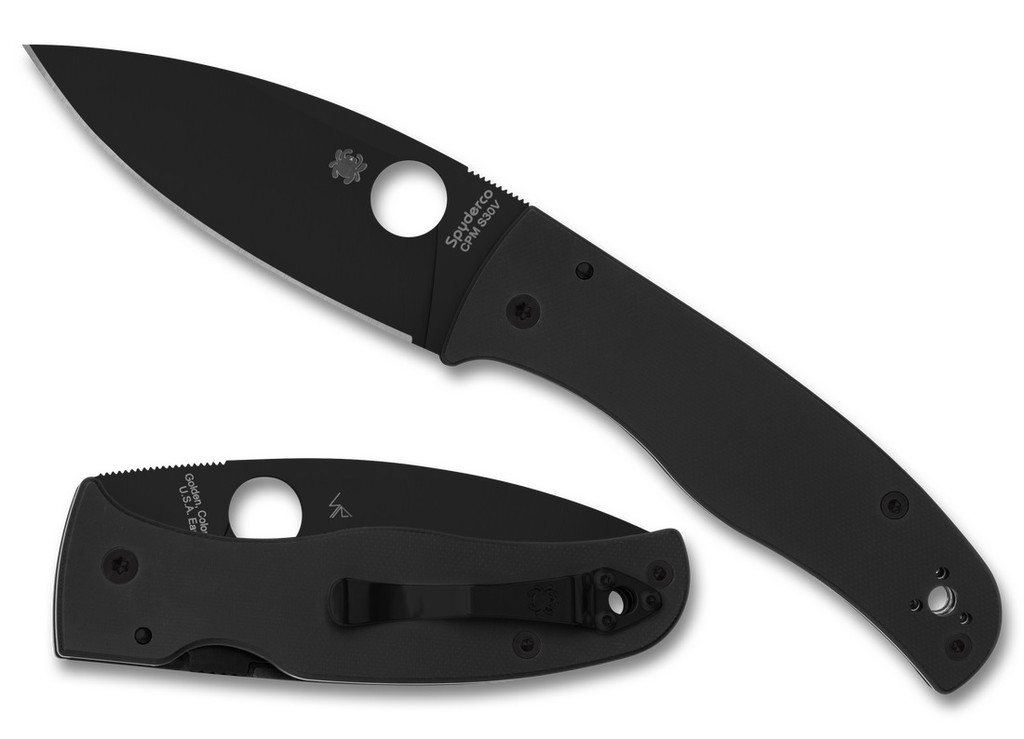Spyderco Bodacious folding knife with thumb hole - shown open presentation side and closed pocket clip side.  Black S30V stainless steel plain edge blade.  Black G-10 handle.  Model C263GPBK.
