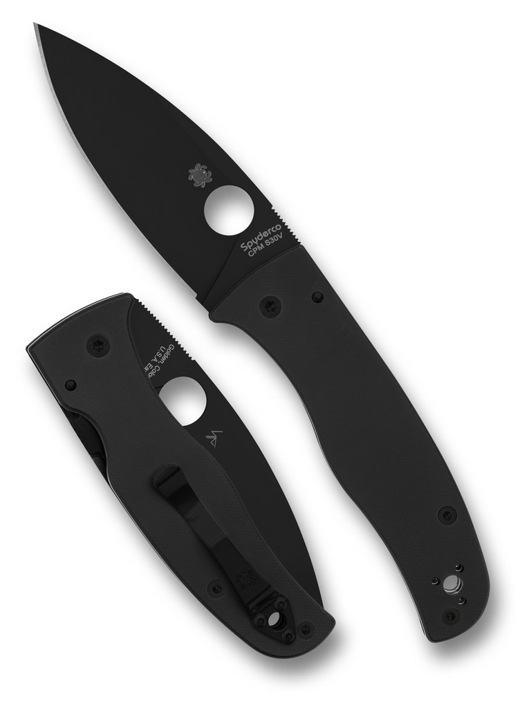 Spyderco Bodacious folding knife with thumb hole - shown open presentation side and closed pocket clip side.  Black S30V stainless steel plain edge blade.  Black G-10 handle.  Model C263GPBK.