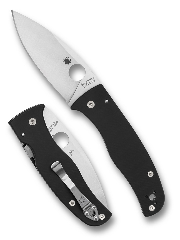 Spyderco Bodacious folding knife with thumb hole - shown open presentation side and closed pocket clip side.  Satin S30V stainless steel plain edge blade.  Black G-10 handle.  Model C263GP.