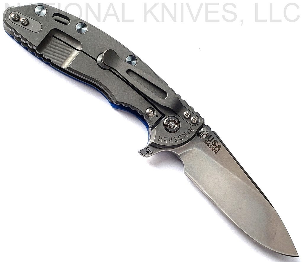 Rick Hinderer Knives XM-18 3.5" Slicer folding knife with thumb stud and flipper tab - shown open lock side.  Stonewash S45VN stainless steel plain edge blade.  Blue G-10 handle with Working Finish lock side.  Model KXM35SL.