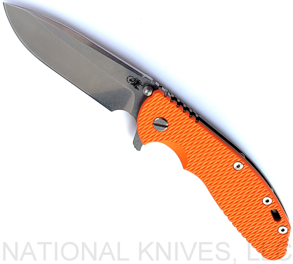 Rick Hinderer Knives XM-24 Spear Point folding knife with thumb stud and flipper tab - shown open presentation side.  Stonewash S45VN stainless steel plain edge blade.  Orange G-10 handle with stonewash bronze lock side.  Model KXM40SPE.