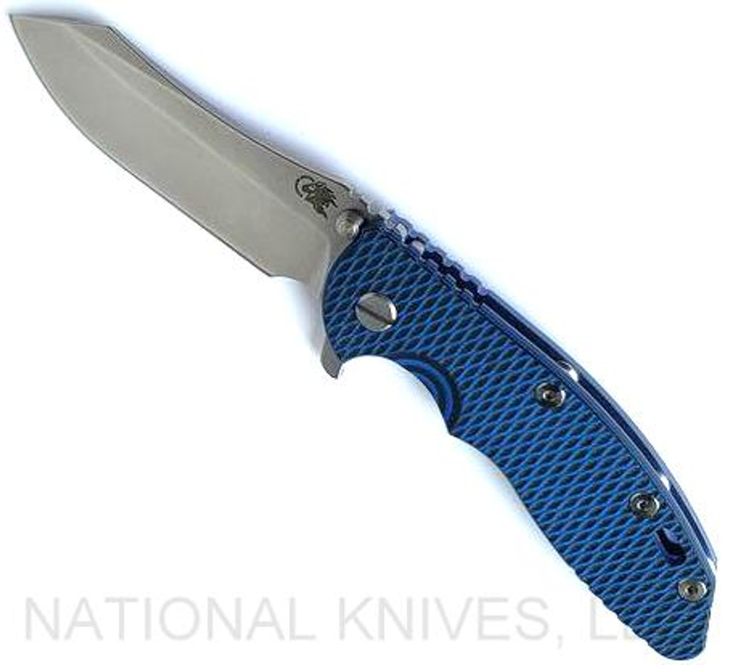 Rick Hinderer Knives XM-18 3.5" Skinner folding knife with thumb stud and flipper tab - shown open presentation side.  Stonewash S45VN stainless steel plain edge blade.  Blue - black G-10 handle with stonewash blue lock side.  Model KXM35SKINNER.