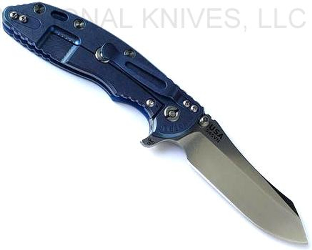 Rick Hinderer Knives XM-18 3.5" Skinner folding knife with thumb stud and flipper tab - shown open lock side.  Stonewash S45VN stainless steel plain edge blade.  Blue - black G-10 handle with stonewash blue lock side.  Model KXM35SKINNER.