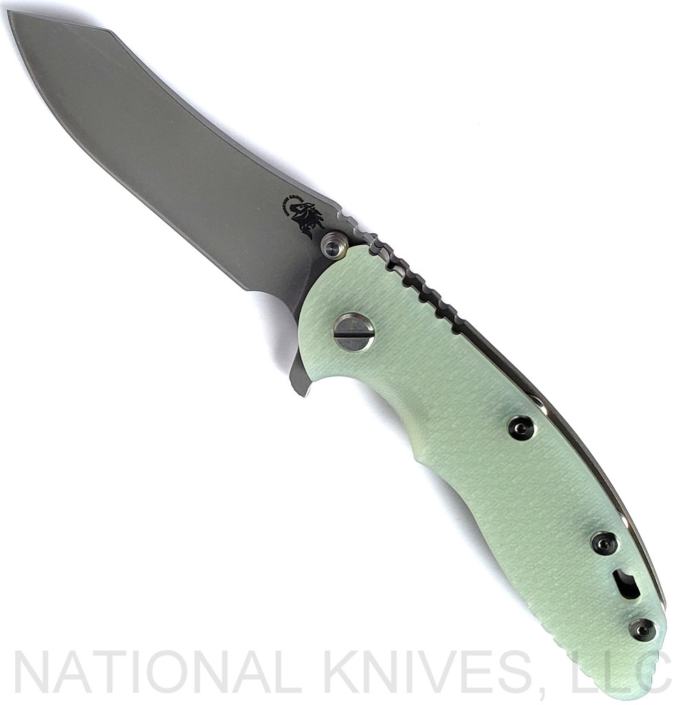 Rick Hinderer Knives XM-18 3.5" Skinner folding knife with thumb stud and flipper tab - shown open presentation side.  Working Finish S45VN stainless steel plain edge blade.  Translucent Green G-10 handle with Battle Bronze lock side.  Model KXM35SKINNER.