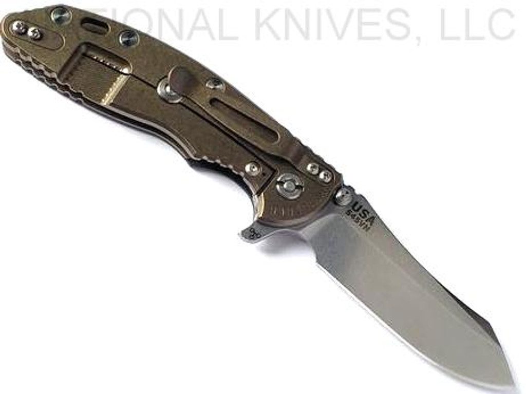 Rick Hinderer Knives XM-18 3.5" Skinner folding knife with thumb stud and flipper tab - shown open lock side.  Stonewash S45VN stainless steel plain edge blade.  Black G-10 handle with stonewash bronze lock side.  Model KXM35SKINNER.