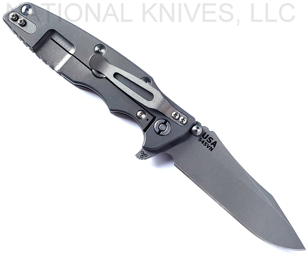 Rick Hinderer Knives Eklipse Spear Point folding knife with flipper tab and thumb stud - shown open lock side.  Working Finish S45VN stainless steel plain edge blade.  FDE G-10 handle with Working Finish lock side.  Model KEK35SPE.