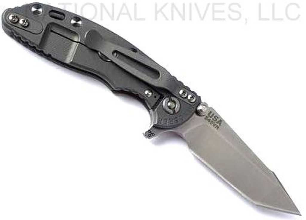 Rick Hinderer Knives XM-18 3.0" Harpoon Tanto folding knife with thumb stud and flipper tab - shown open lock side.  Stonewash S45VN stainless steel plain edge blade.  FDE G-10 handle with Working Finish lock side.  Model KXM3000HT.