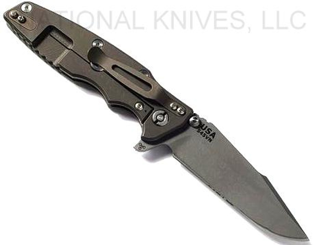 Rick Hinderer Knives Eklipse Harpoon Spanto folding knife with flipper tab and thumb stud - shown open lock side.  Working Finish S45VN stainless steel plain edge blade.  OD green G-10 handle with Battle Bronze lock side.  Model KEK35HSA.