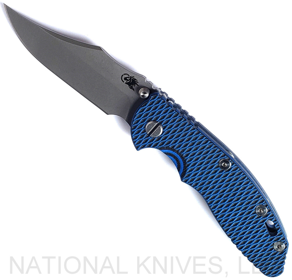 Rick Hinderer Knives Non Flipper XM-18 3.5" Bowie folding knife with thumb stud - shown open presentation side.  Working Finish S45VN stainless steel plain edge blade.  Blue - black G-10 handle with Battle Blue lock side.  Model KXM35NFBOW.