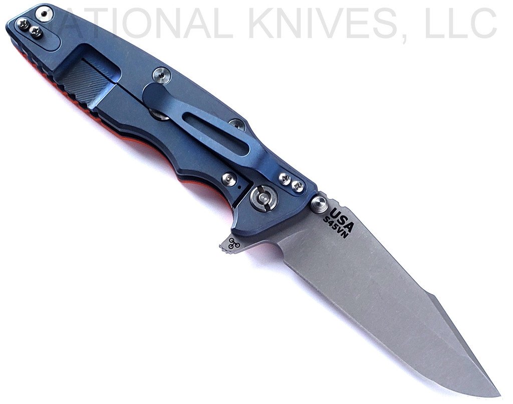 Rick Hinderer Knives Eklipse Harpoon Spanto folding knife with flipper tab and thumb stud - shown open lock side.  Working Finish S45VN stainless steel plain edge blade.  Orange G-10 handle with Battle Blue lock side.  Model KEK35HSA.