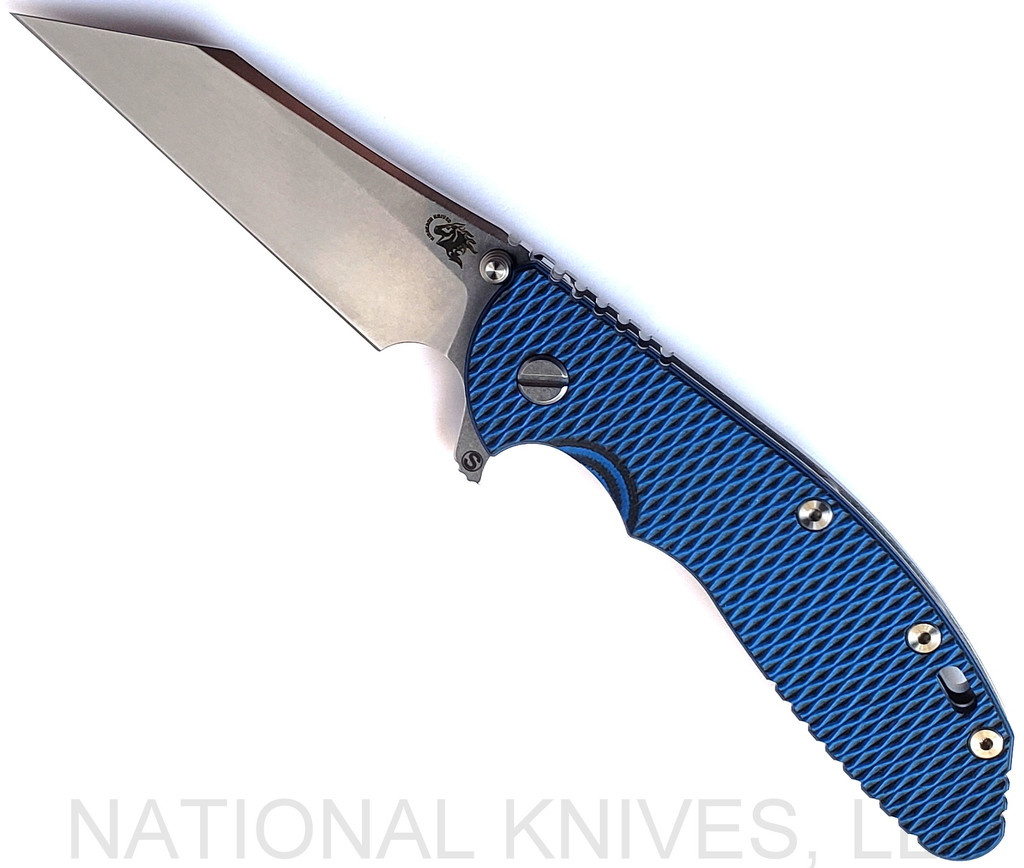 Rick Hinderer Knives Skinny XM-24 Wharncliffe folding knife with thumb stud and flipper tab - shown open presentation side.  Stonewash S45VN stainless steel plain edge blade.  Blue - black G-10 handle with stonewash lock side.  Model KXM40SKWC.