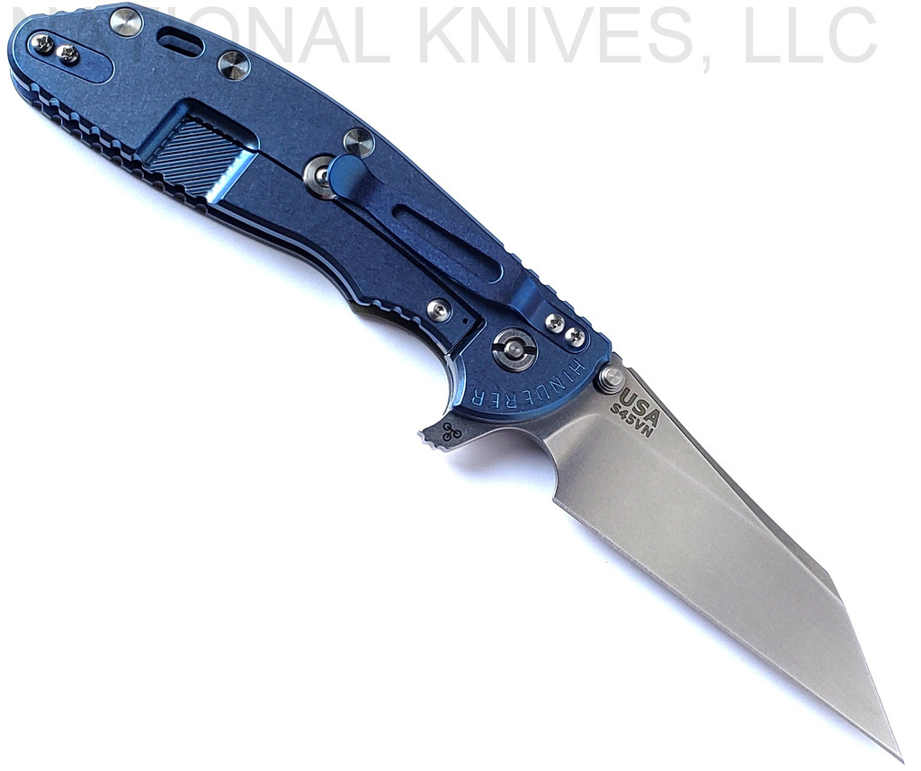 Rick Hinderer Knives Skinny XM-24 Wharncliffe folding knife with thumb stud and flipper tab - shown open lock side.  Stonewash S45VN stainless steel plain edge blade.  OD green G-10 handle with stonewash blue lock side.  Model KXM40SKWC.
