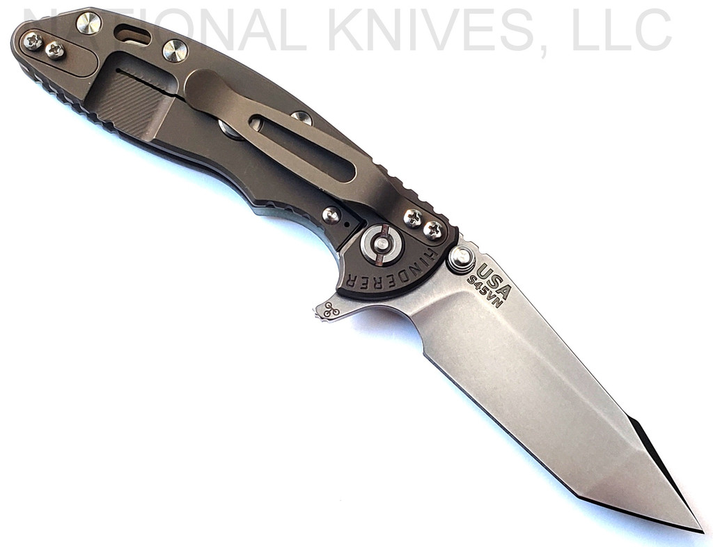 Rick Hinderer Knives XM-18 3.0" Harpoon Tanto folding knife with thumb stud and flipper tab - shown open lock side.  Stonewash S45VN stainless steel plain edge blade.  Translucent Green G-10 handle with Battle Bronze lock side.  Model KXM3000HT.