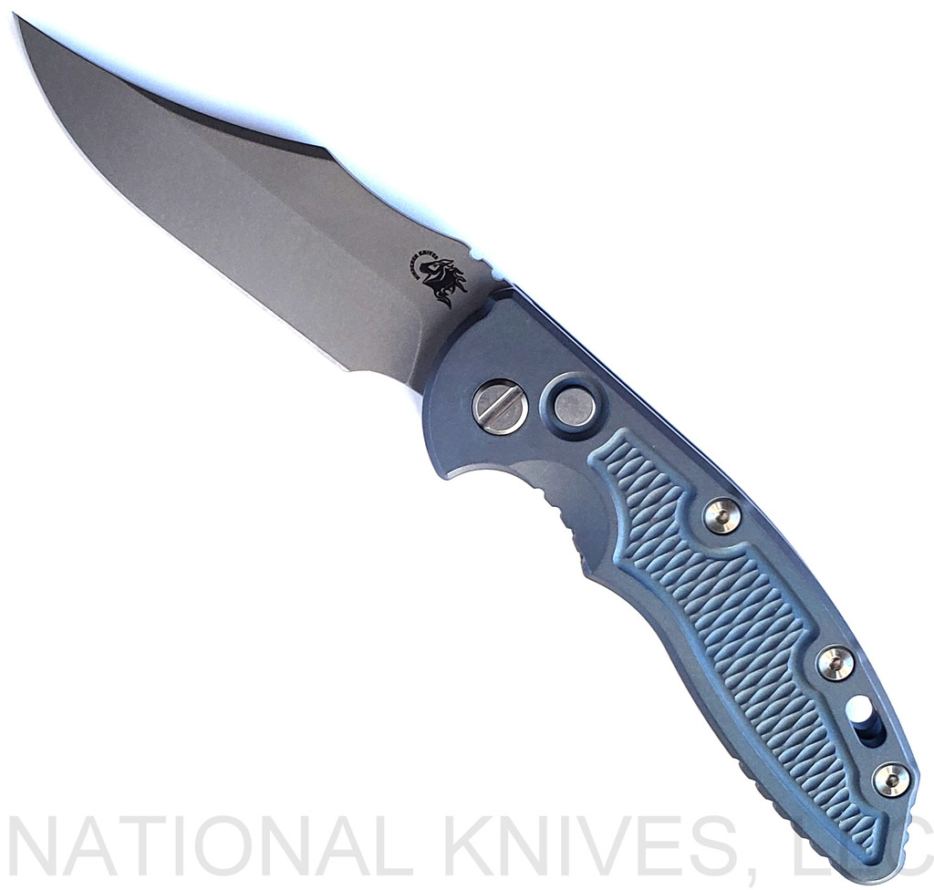 Rick Hinderer Knives Automatic XM-18 Bowie folding knife with push button - shown open presentation side.  Working Finish S45VN stainless steel plain edge blade.  Battle Blue titanium handle.  Model KAXM35BO.