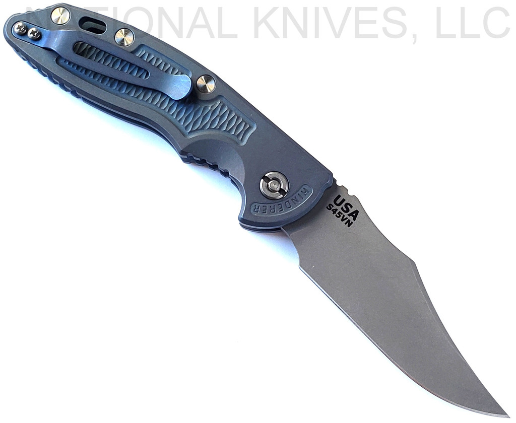 Rick Hinderer Knives Automatic XM-18 Bowie folding knife with push button - shown open pocket clip side.  Working Finish S45VN stainless steel plain edge blade.  Battle Blue titanium handle.  Model KAXM35BO.