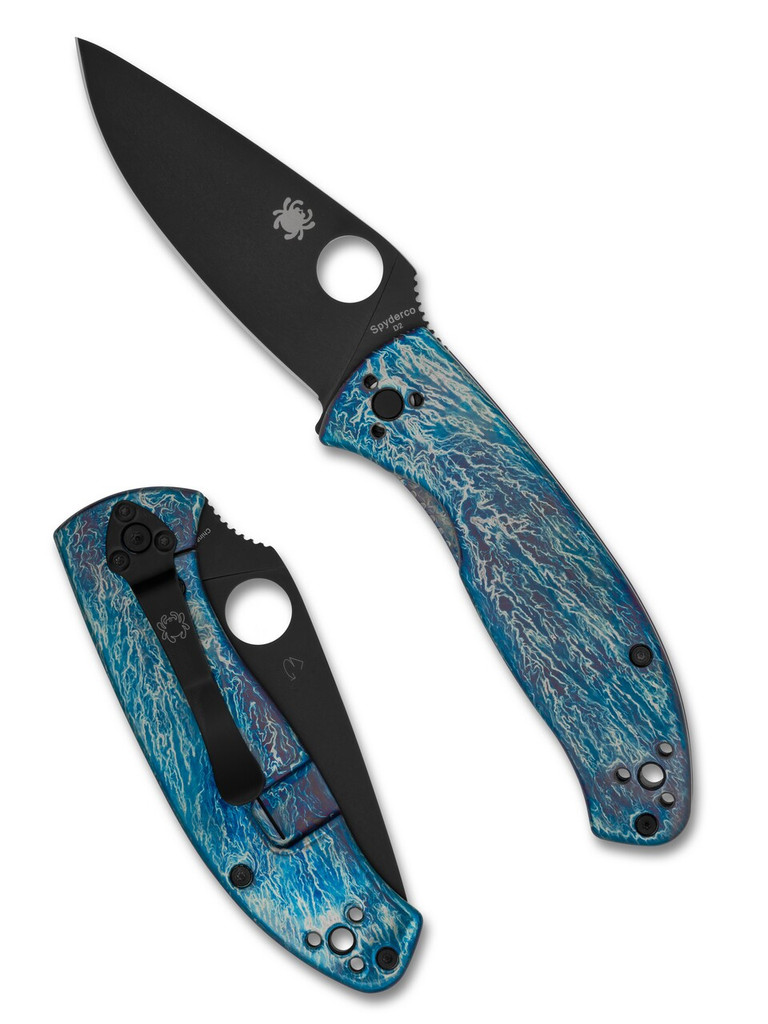 Spyderco Tenacious folding knife with thumb hole - shown open presentation side and closed pocket clip side.  Black D2 steel plain edge blade.  Disarray titanium handle.  Model C122TIBLBKD2P.