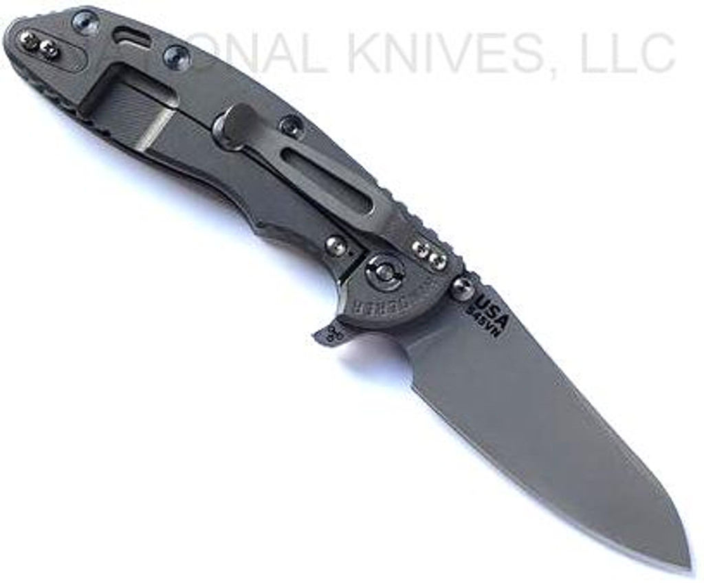 Rick Hinderer Knives XM-18 3.5" Sheepsfoot folding knife with thumb stud and flipper tab - shown open lock side.  Working Finish S45VN stainless steel plain edge blade.  Translucent Green G-10 handle with Working Finish lock side.  Model KXM35SHF.