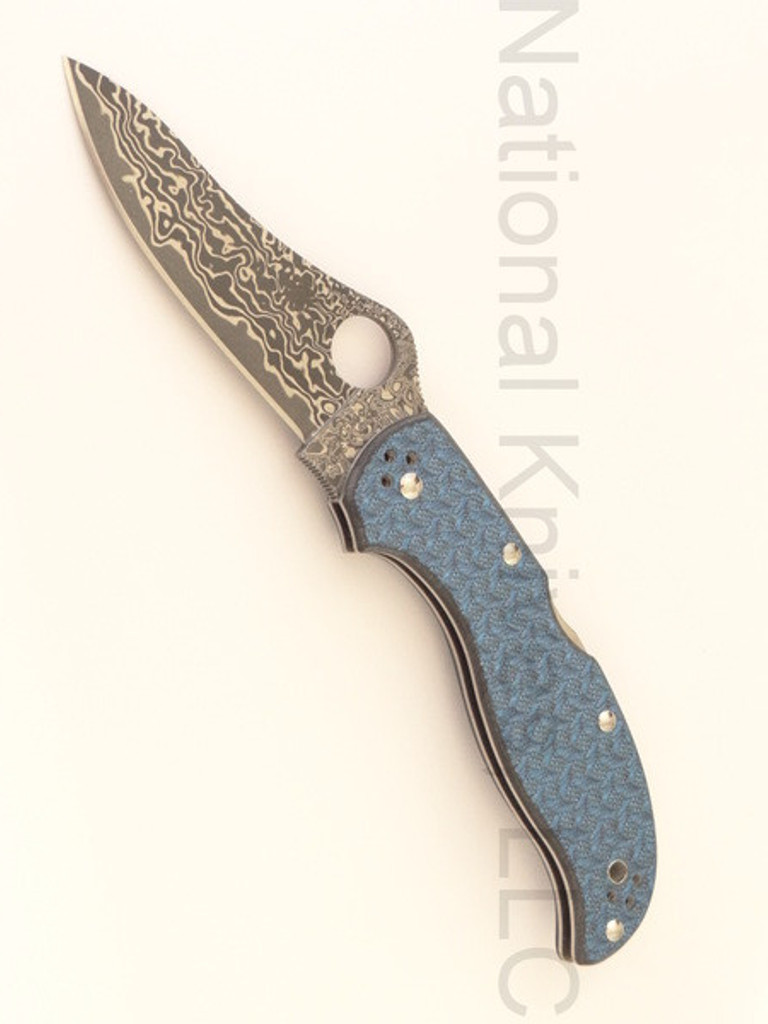 Spyderco Stretch limited edition folding knife with thumb hole - shown open presentation side.  Damascus steel plain edge blade.  Blue Nishijin glass fiber handle.  Model C90GFBLPD.
For reference only.