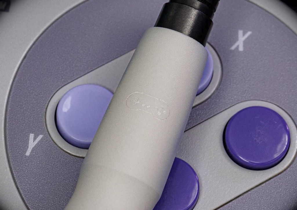 Tuff Writer Precision Press Pen - Super Precision V-Spec limited edition - close up of game controller engraving.  Gray, purple, and black aluminum body with black ink.