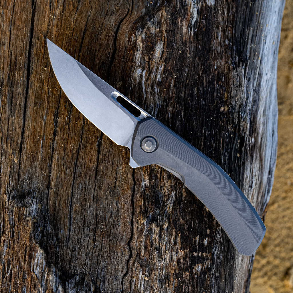 Tactile Knife Co Archer folding knife with flipper tab - shown open presentation side.  Satin MagnaCut stainless steel plain edge blade.  Darkwash titanium handle.  Model 20-AR-MC01-TTF1