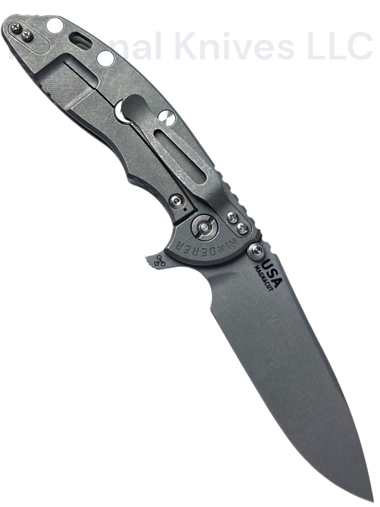 Rick Hinderer Knives XM-18 Skinny Slicer with thumb stud and flipper tab - shown open lock side.  Working Finish Magnacut stainless steel, hollow ground, plain edge blade.  Translucent Green G-10 handle with Working Finish lock side. 