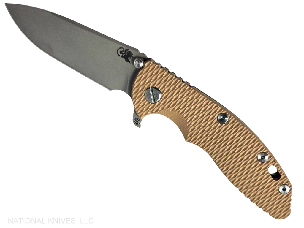 Rick Hinderer Knives XM-18 Skinny Slicer with thumb stud and flipper tab - shown open presentation side.  Working Finish Magnacut stainless steel, hollow ground, plain edge blade.  Coyote Brown G-10 handle with Battle Bronze lock side. 