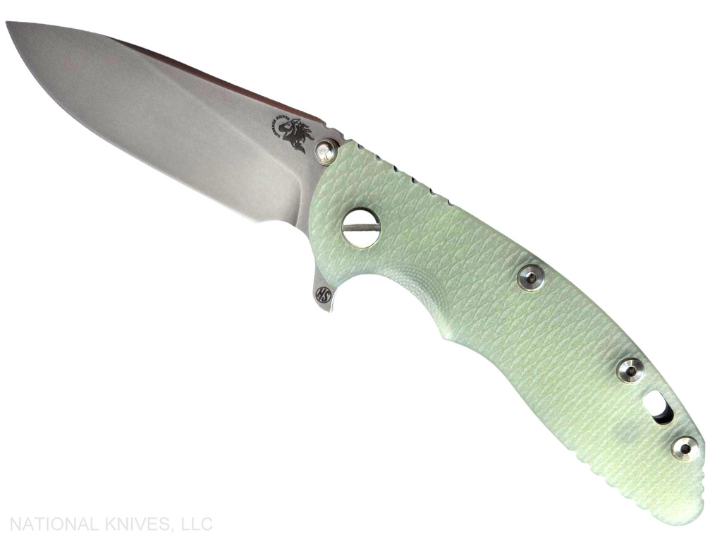 Rick Hinderer Knives XM-18 Skinny Slicer with thumb stud and flipper tab - shown open presentation side.  Stonewash Magnacut stainless steel, hollow ground, plain edge blade.  Translucent Green G-10 handle with stonewash lock side. 