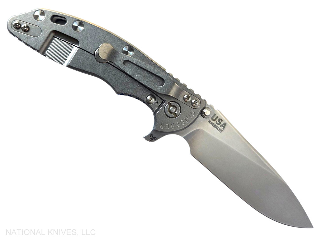 Rick Hinderer Knives XM-18 Skinny Slicer with thumb stud and flipper tab - shown open lock side.  Stonewash Magnacut stainless steel, hollow ground, plain edge blade.  Blue - Black G-10 handle with stonewash lock side. 