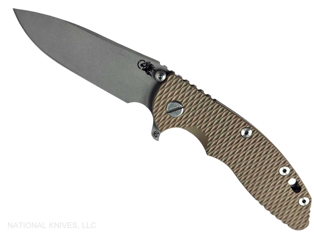 Rick Hinderer Knives XM-18 Skinny Slicer with thumb stud and flipper tab - shown open presentation side.  Working Finish Magnacut stainless steel, hollow ground, plain edge blade.   FDE G-10 handle with Battle Bronze lock side. 