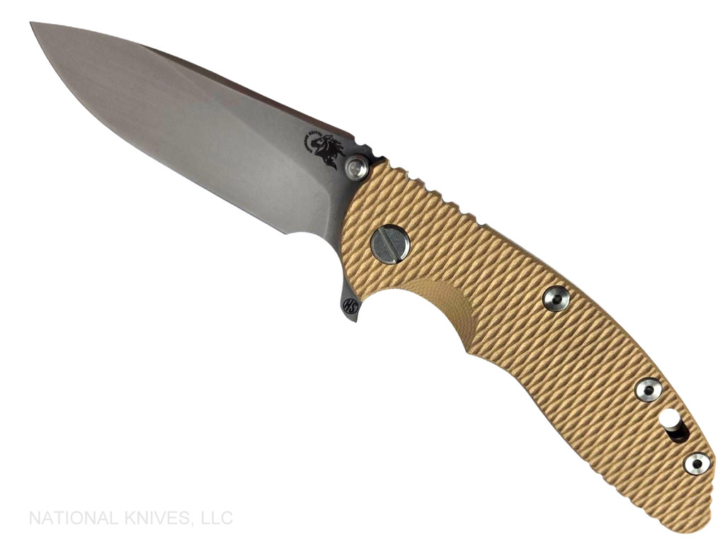 Rick Hinderer Knives XM-18 Skinny Slicer with thumb stud and flipper tab - shown open presentation side.  Stonewash Magnacut stainless steel, hollow ground, plain edge blade.  Coyote Brown G-10 handle with stonewash bronze lock side. 