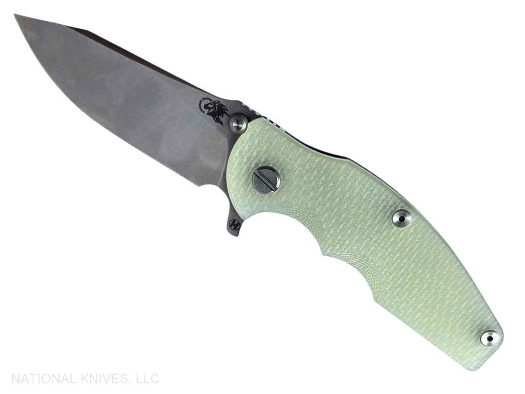Rick Hinderer Knives Jurassic Hollow Grind Slicer folding knife with flipper tab - shown open presentation side.  Stonewash MagnaCut stainless steel plain edge blade.  Translucent Green G-10 handle scale with stonewash titanium lock side.  Model KJURSLHO.