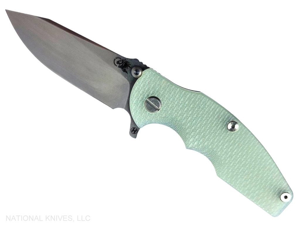 Rick Hinderer Knives Jurassic Hollow Grind Slicer folding knife with flipper tab - shown open presentation side.  Stonewash MagnaCut stainless steel plain edge blade.  Translucent Green G-10 handle scale with stonewash blue titanium lock side.  Model KJURSLHO.