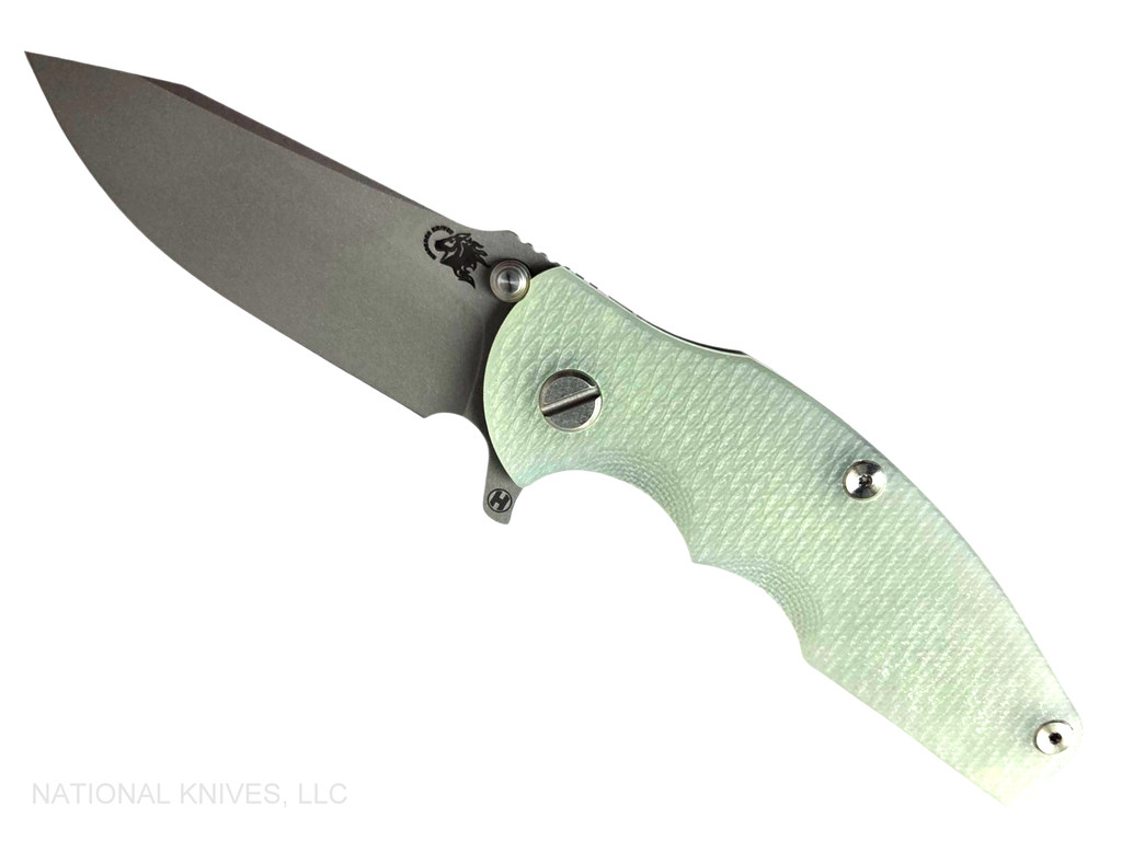 Rick Hinderer Knives Jurassic Hollow Grind Slicer folding knife with flipper tab - shown open presentation side.  Working Finish MagnaCut stainless steel plain edge blade.  Translucent Green G-10 handle scale with Battle Bronze titanium lock side.  Model KJURSLHO.