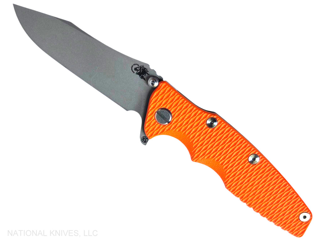 Rick Hinderer Knives Skinny Eklipse Slicer folding knife with flipper tab - shown open - presentation side.  Working Finish 3.5" hollow grind MagnaCut stainless steel plain edge blade.  Orange G-10 handle scale with Battle Bronze lock side.  Model KEK35SKSLHO