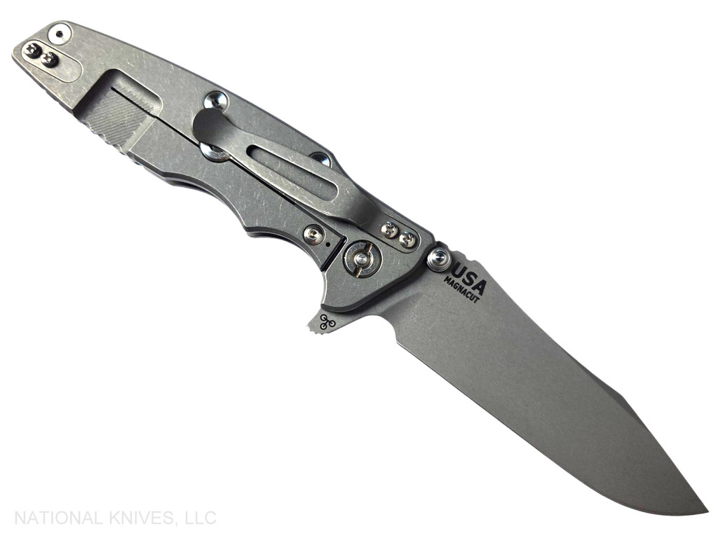 Rick Hinderer Knives Skinny Eklipse Slicer folding knife with flipper tab - shown open - lock side.  Working Finish 3.5" hollow grind MagnaCut stainless steel plain edge blade.  Blue - black G-10 handle scale with Working Finish lock side.  Model KEK35SKSLHO