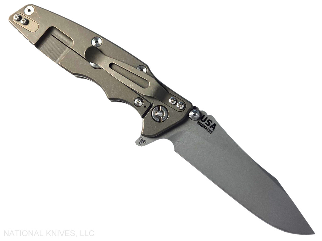 Rick Hinderer Knives Skinny Eklipse Slicer folding knife with flipper tab - shown open - lock side.  Working Finish 3.5" hollow grind MagnaCut stainless steel plain edge blade.  OD green G-10 handle scale with Battle Bronze lock side.  Model KEK35SKSLHO