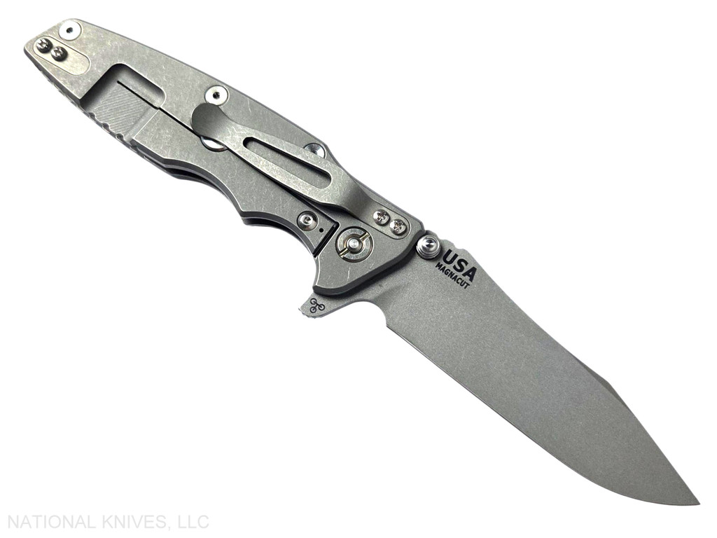 Rick Hinderer Knives Skinny Eklipse Slicer folding knife with flipper tab - shown open - lock side.  Working Finish 3.5" hollow grind MagnaCut stainless steel plain edge blade.  Translucent Green G-10 handle scale with Working Finish lock side.  Model KEK35SKSLHO
