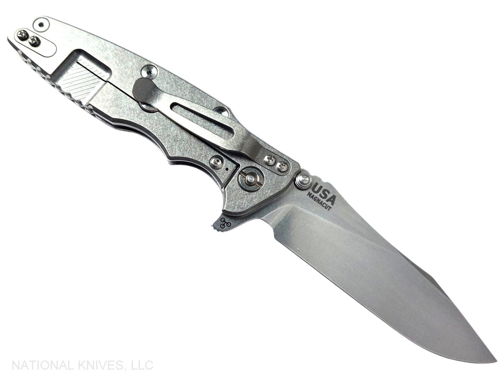 Rick Hinderer Knives Skinny Eklipse Slicer folding knife with flipper tab - shown open - lock side.  Stonewash 3.5" hollow grind MagnaCut stainless steel plain edge blade.  FDE G-10 handle scale with stonewash lock side.  Model KEK35SKSLHO