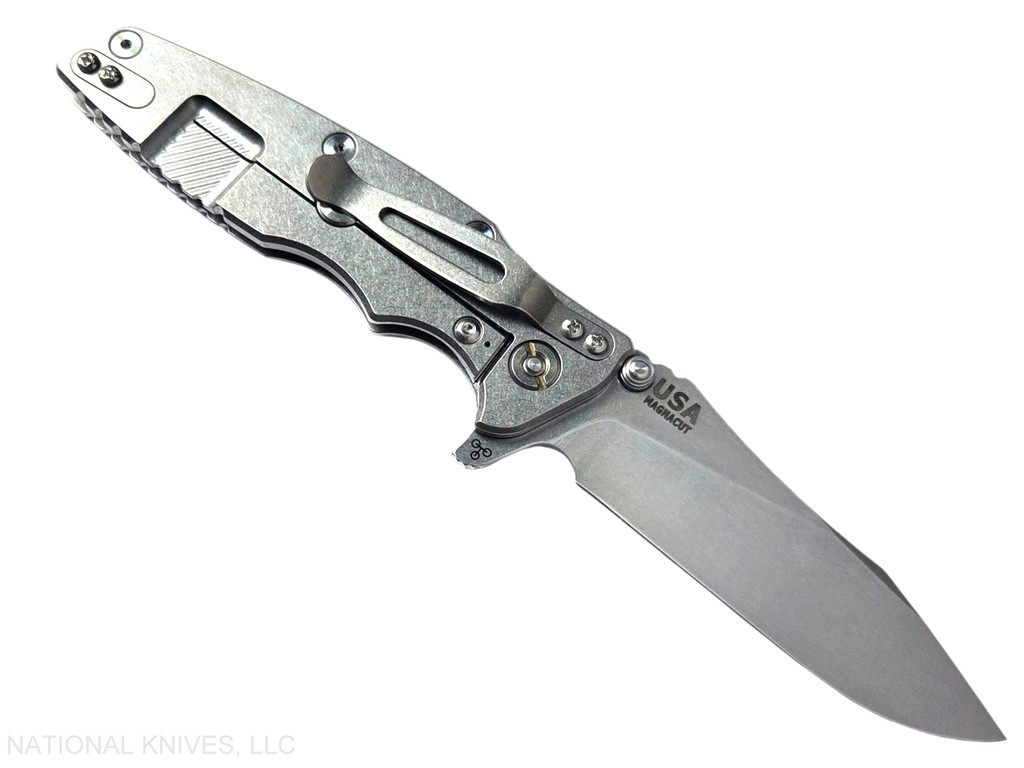 Rick Hinderer Knives Skinny Eklipse Slicer folding knife with flipper tab - shown open - lock side.  Stonewash 3.5" hollow grind MagnaCut stainless steel plain edge blade.  Blue - black G-10 handle scale with stonewash lock side.  Model KEK35SKSLHO