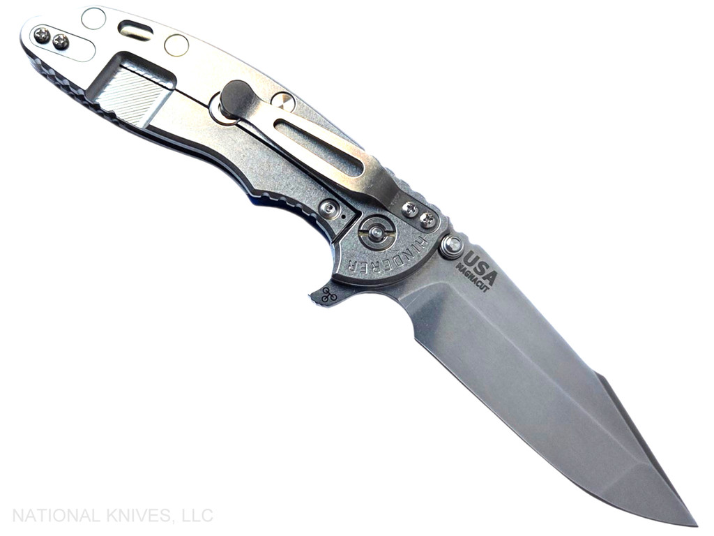 Rick Hinderer Knives XM-18 Skinny Harpoon Spanto with thumb stud and flipper tab - shown open lock side.  Stonewash Magnacut stainless steel plain edge blade.  Blue - black G-10 handle with stonewash lock side.  Model KXM35SKHS.